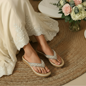 Lifestyle image of embellished wedge flip-flops with wedding outfit