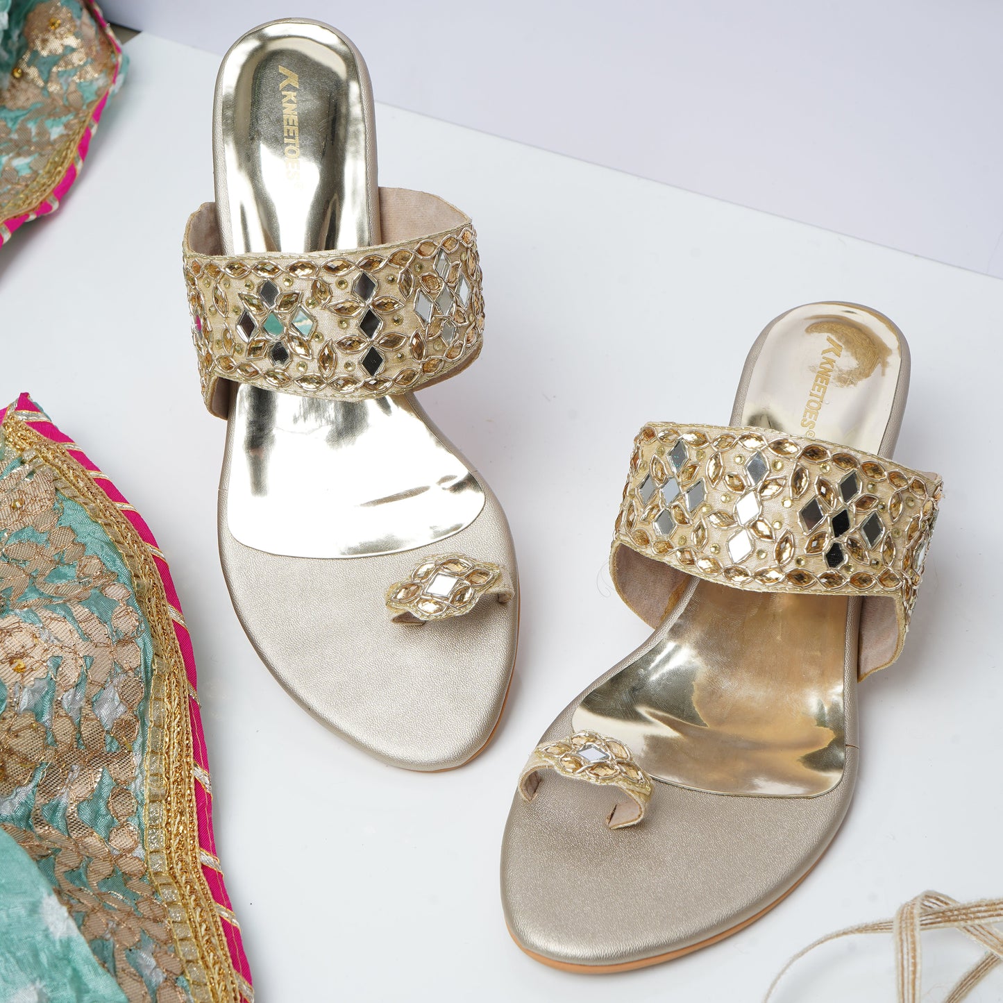 Trendy Stone work Gold Slipper featuring Toe strap Design for Party wear