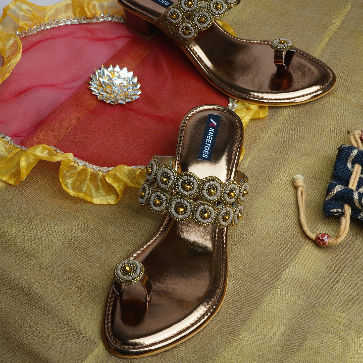 Contemporary Stone work Antique Slipper featuring Toe ring Design for Party wear