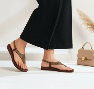 Brown studded flat sandals with realistic legs and props